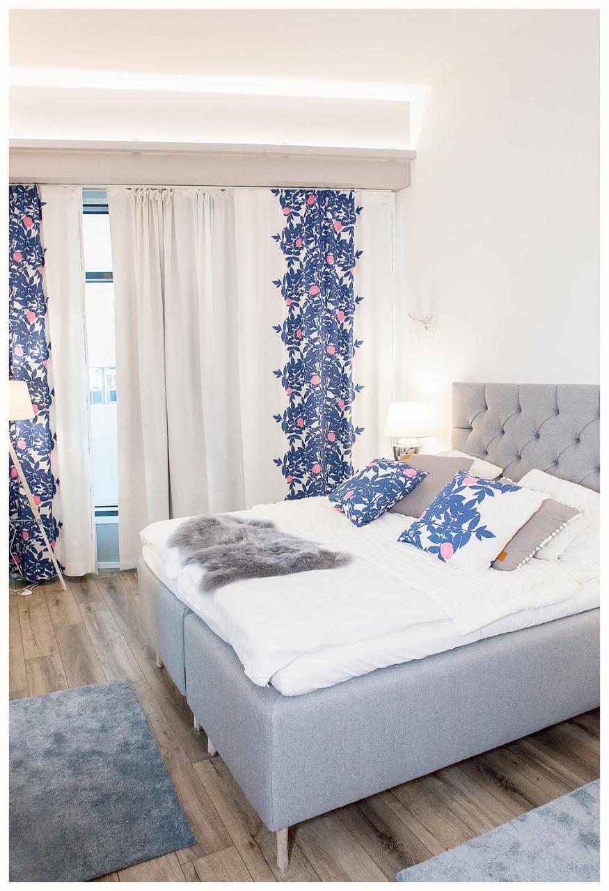 Crystal Arctic Suites Rovaniemi Exterior photo Bedroom with curtains and cushions