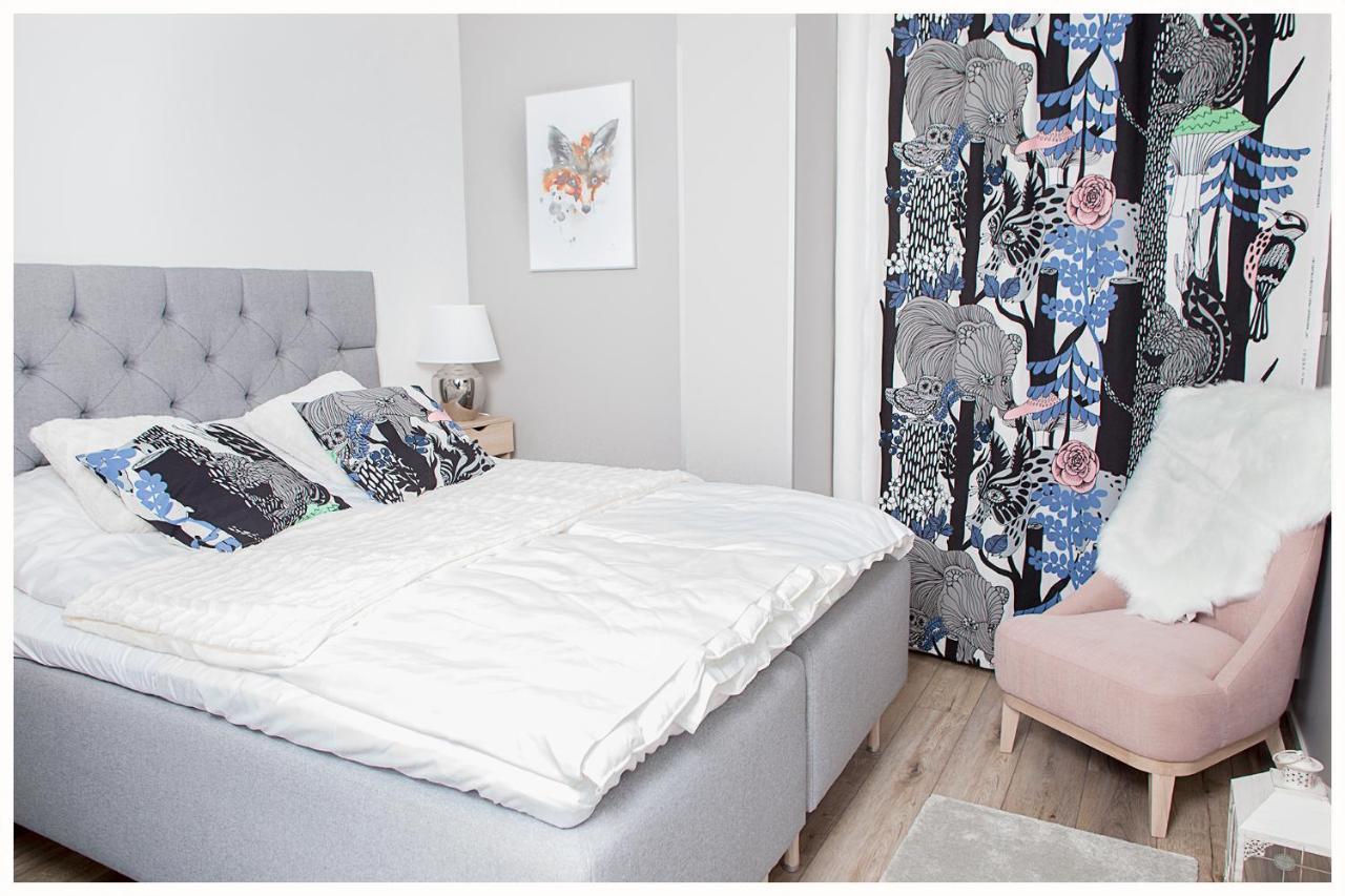 Crystal Arctic Suites Rovaniemi Exterior photo Bedroom with a bed and a chair